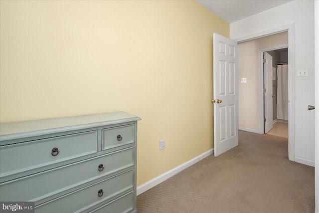 corridor with light colored carpet