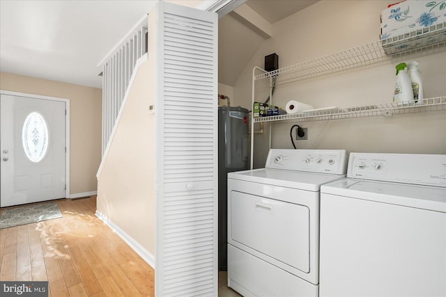 washroom featuring light wood-type flooring and separate washer and dryer