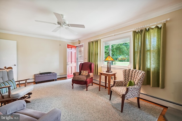 living area featuring ceiling fan, baseboard heating, and ornamental molding