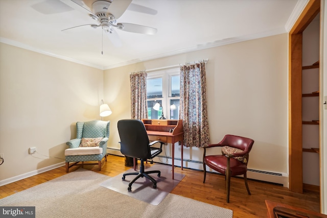 office space with ornamental molding, wood-type flooring, ceiling fan, and a baseboard radiator