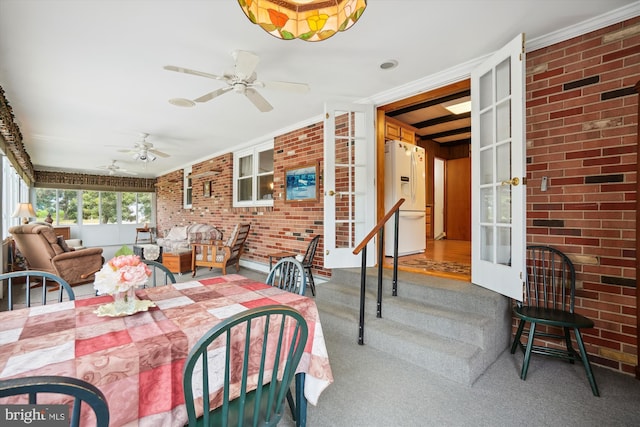 interior space with ceiling fan