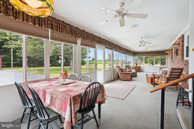 sunroom / solarium with ceiling fan and plenty of natural light