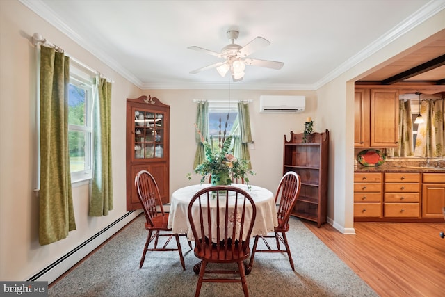 dining area featuring a wall unit AC, a baseboard radiator, plenty of natural light, and light hardwood / wood-style floors