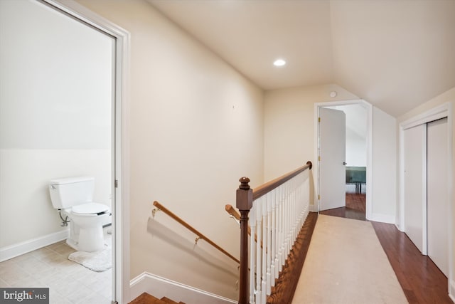 interior space with hardwood / wood-style flooring and lofted ceiling