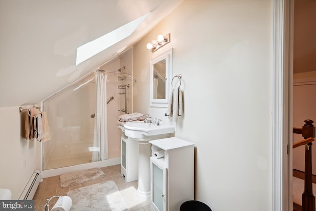 bathroom with a skylight, tile patterned flooring, a tile shower, and a baseboard heating unit