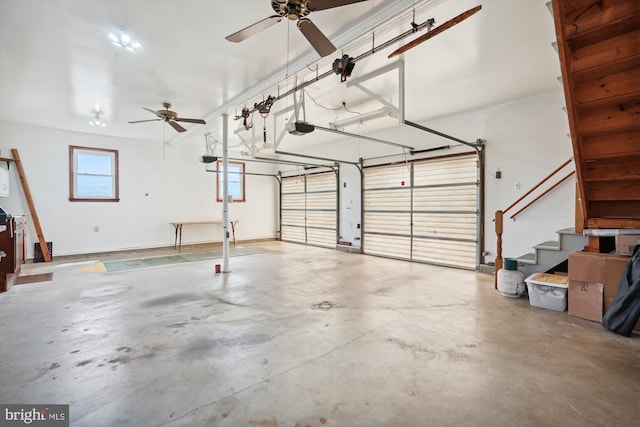 garage with a garage door opener and ceiling fan