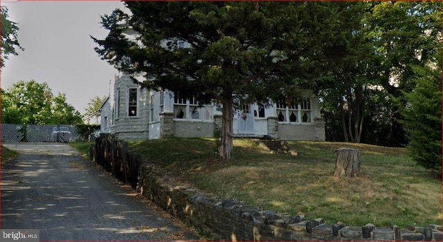 view of property hidden behind natural elements