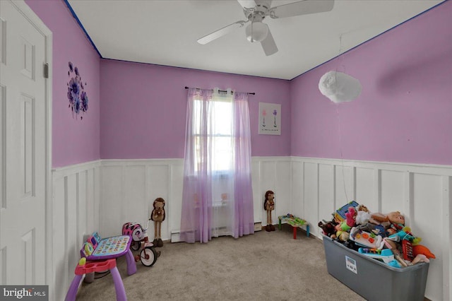 recreation room featuring light colored carpet and ceiling fan