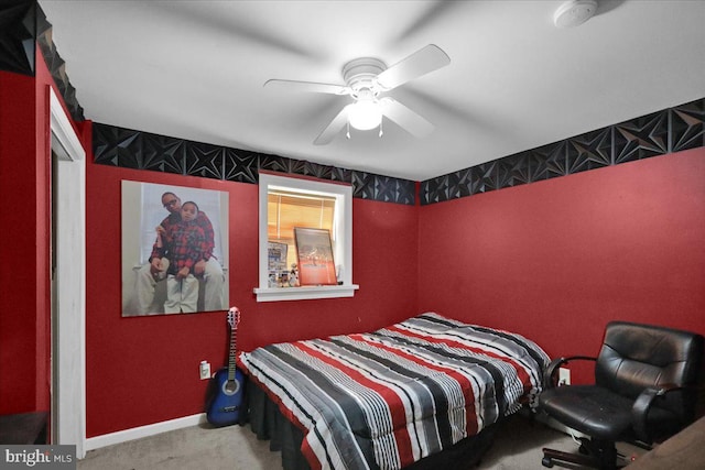 bedroom featuring ceiling fan and light carpet