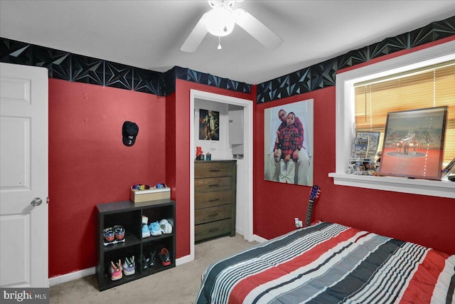 bedroom with light colored carpet and ceiling fan