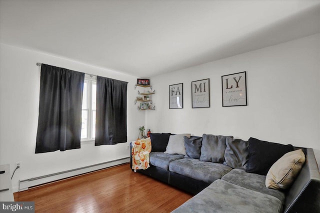 living room with hardwood / wood-style flooring and a baseboard radiator