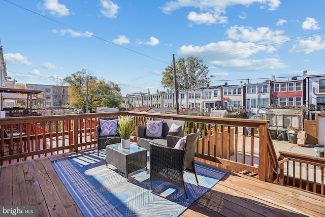 wooden terrace featuring an outdoor living space