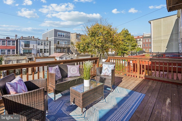 wooden deck with outdoor lounge area