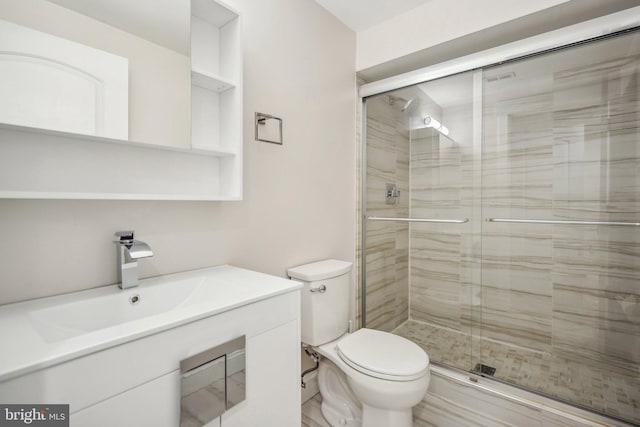 bathroom featuring walk in shower, sink, and toilet