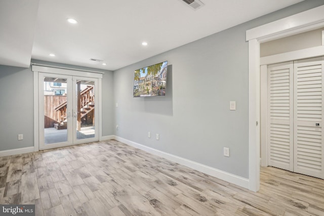 interior space featuring french doors and light hardwood / wood-style flooring