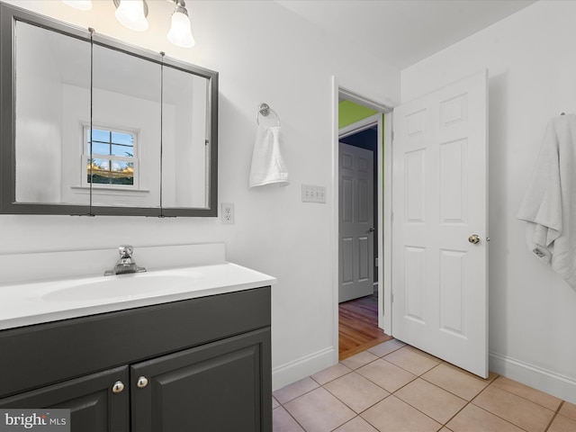 bathroom with tile patterned floors and vanity