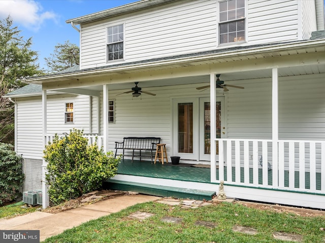 property entrance featuring ceiling fan and central AC unit