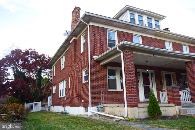 view of property exterior with a porch