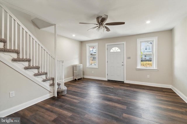 entrance foyer with radiator, ceiling fan, and dark hardwood / wood-style flooring