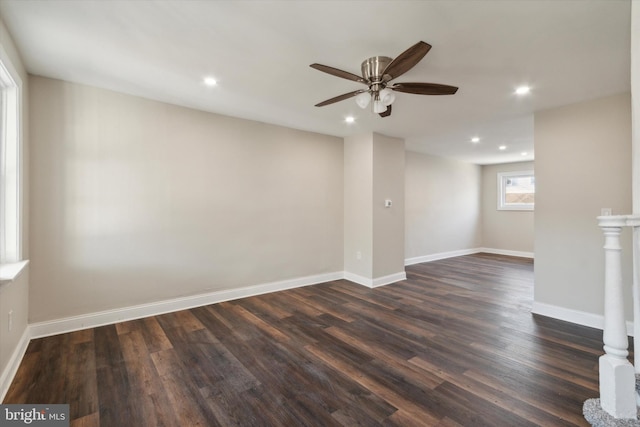 empty room with dark wood-type flooring and ceiling fan