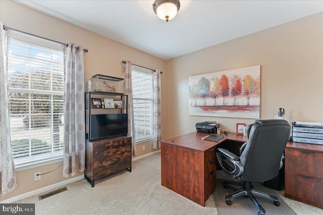 office area with light colored carpet