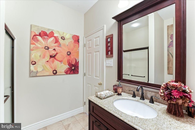 bathroom with tile patterned flooring and vanity