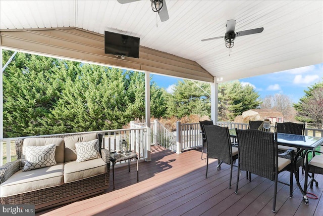 deck featuring outdoor lounge area and ceiling fan