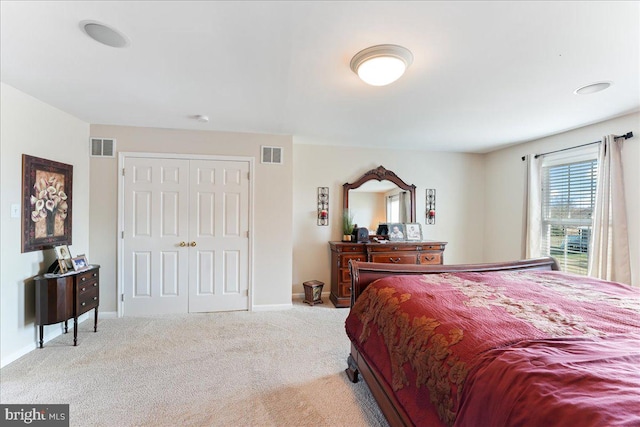 carpeted bedroom featuring a closet