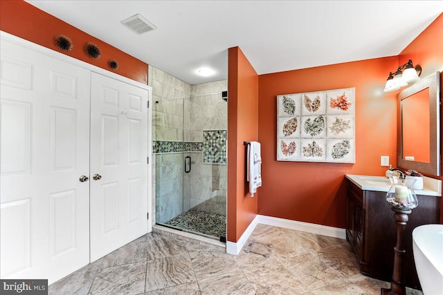 bathroom with an enclosed shower and vanity