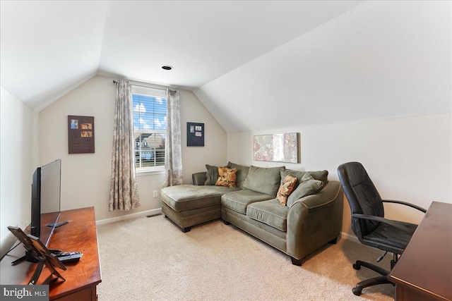 carpeted home office with lofted ceiling