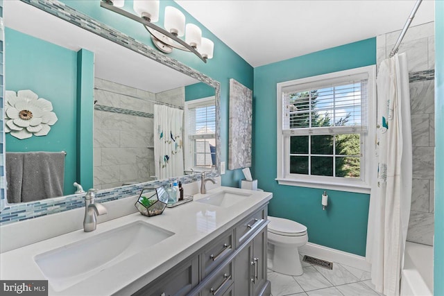 full bathroom with shower / bath combo with shower curtain, vanity, and toilet