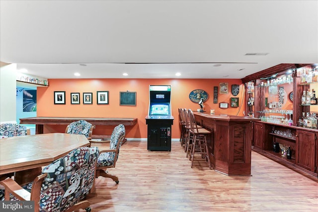 interior space featuring light wood-type flooring and dark brown cabinets