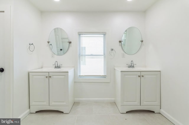 bathroom featuring tile patterned flooring and vanity