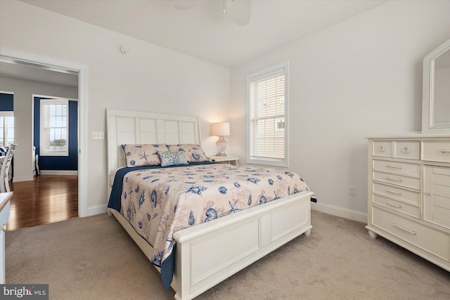 carpeted bedroom featuring ceiling fan