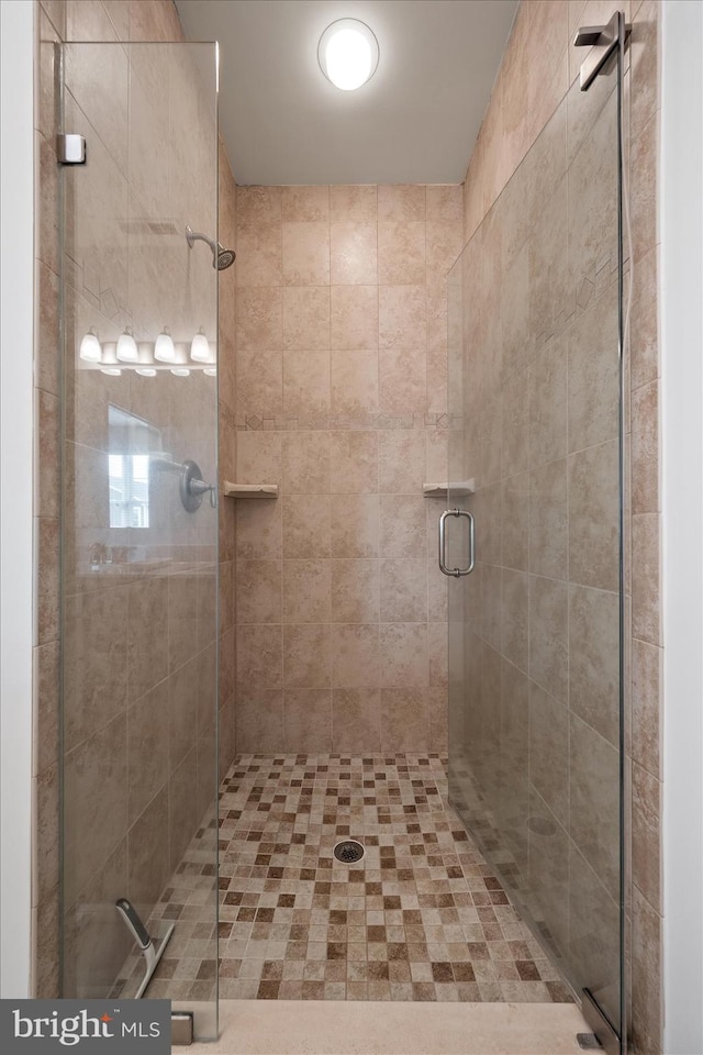 bathroom featuring an enclosed shower