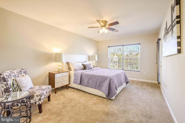 bedroom featuring ceiling fan and light carpet