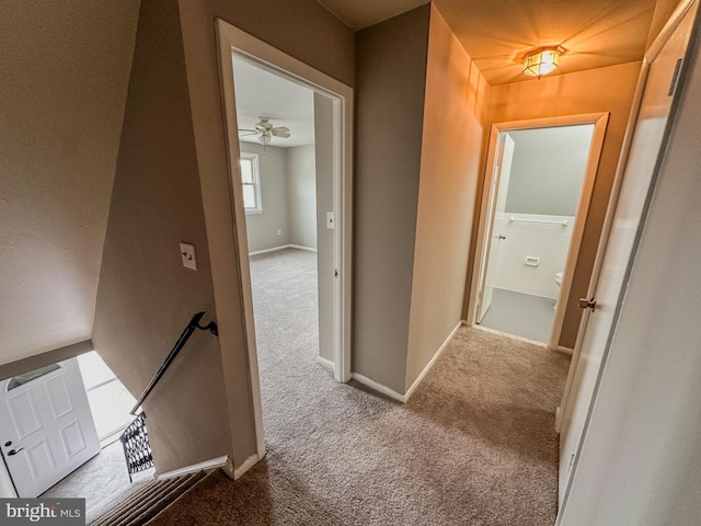 hallway featuring light carpet