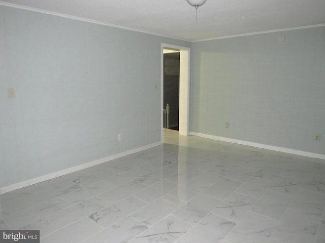 unfurnished room with ornamental molding