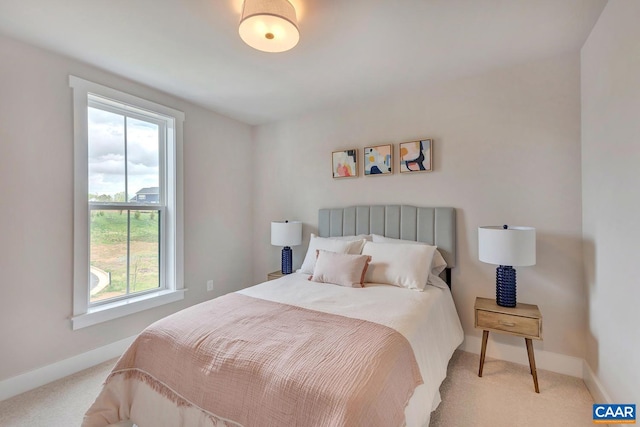 carpeted bedroom with multiple windows