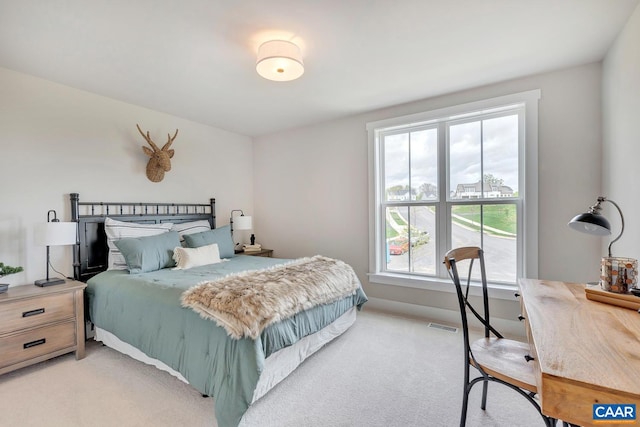 bedroom featuring light colored carpet