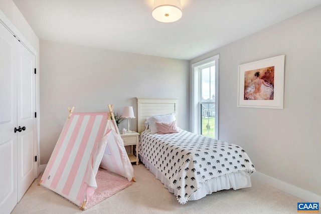 carpeted bedroom with a closet