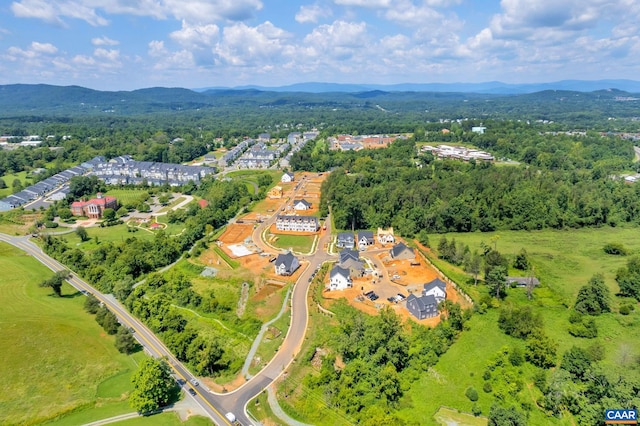 birds eye view of property featuring a mountain view