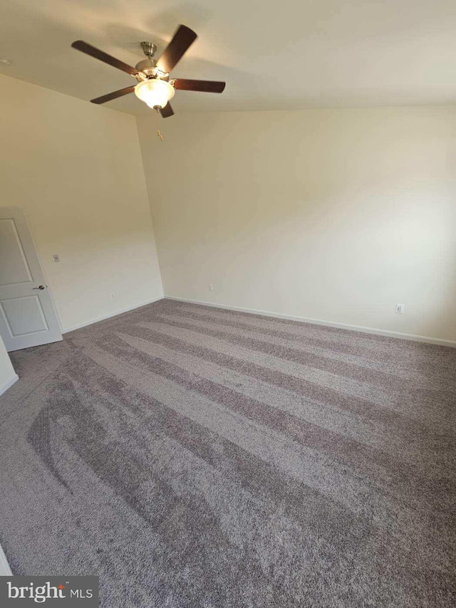 empty room featuring carpet and ceiling fan