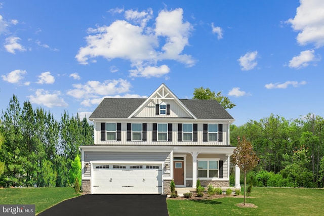 view of front of house with a front lawn and a garage