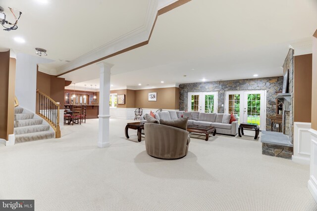6318 Georgetown Pike, Mclean, VA 22101 - carpeted living room with ornamental molding, ornate columns, a wainscoted wall, stairs, and a decorative wall