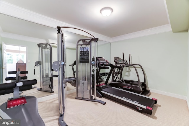 gym with carpet flooring and ornamental molding