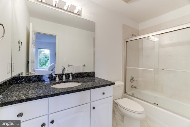 6318 Georgetown Pike, Mclean, VA 22101 - full bath with toilet, vanity, bath / shower combo with glass door, and tile patterned flooring