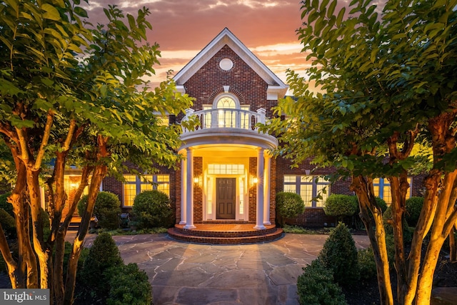 6318 Georgetown Pike, Mclean, VA 22101 - doorway to property featuring brick siding and a balcony