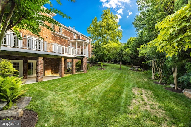 view of yard with a patio and a deck