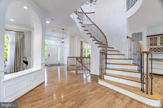 6318 Georgetown Pike, Mclean, VA 22101 - entrance foyer featuring crown molding, wood finished floors, stairway, and recessed lighting